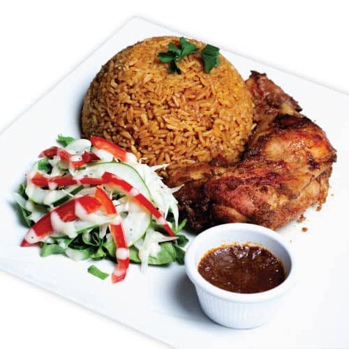 Jollof rice with chicken and salad +egg